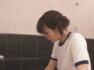 Japanese chick in the bathroom sucking on a big cock